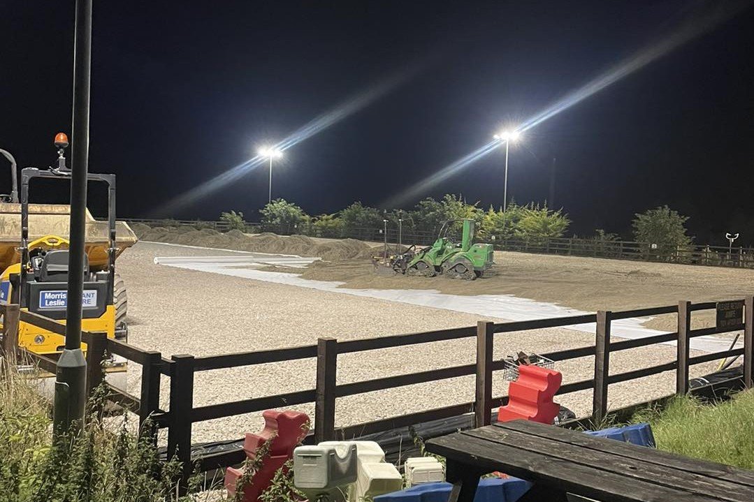 Grading silica sand arena surface using an Avant loader and SharpGrade box grader at the Royal Artillery Saddle Club in Larkhill, completed by AG Rural Solutions.